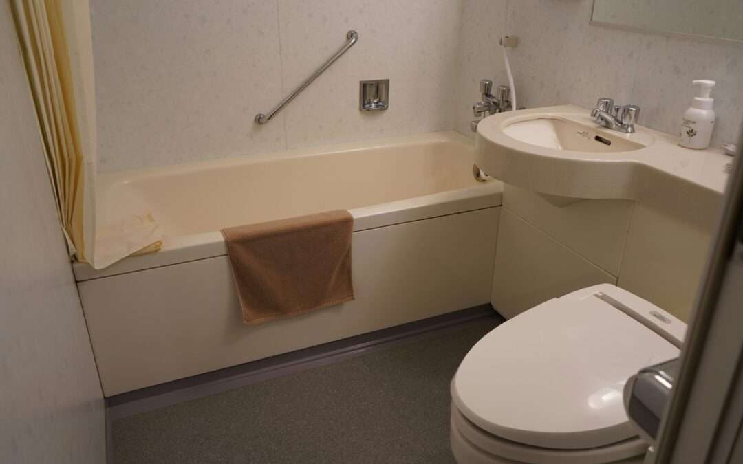 A senior woman using bathtub aids, including grab bars and a non-slip mat, demonstrating safe bathing practices.